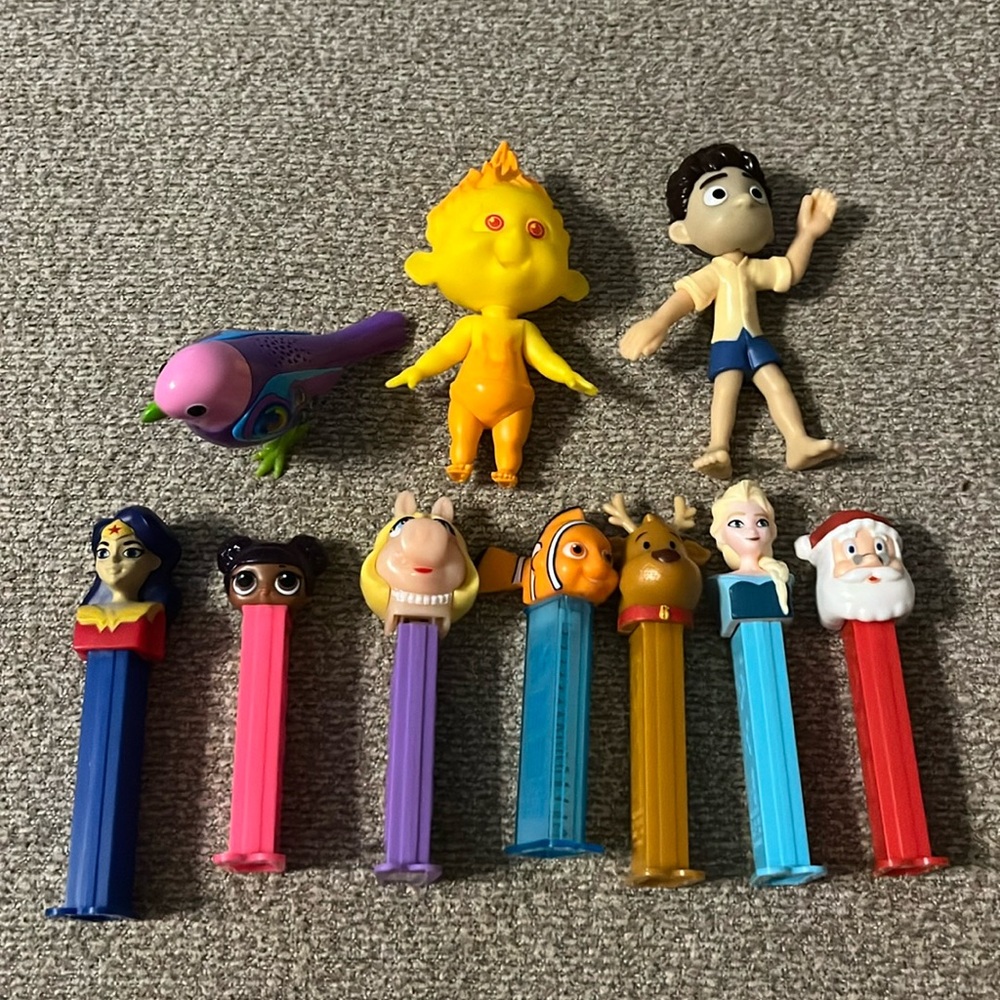 Variety of Pez dispensers and other figures.